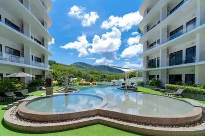 a view of the courtyard of a building with a swimming pool at Duplex Naiharn UTL A123 - Perfect Stay near Beach in Rawai Beach