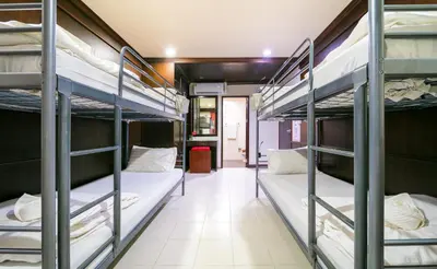 a group of bunk beds in a room at EBS Hostel Phuket in Karon Beach