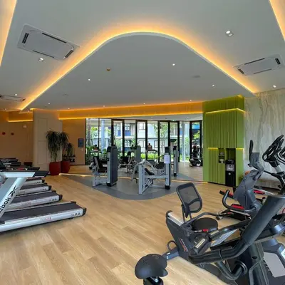 a gym with a bunch of exercise bikes in a room at Dcondo Reef Serenity Condo 2 in Phuket Town