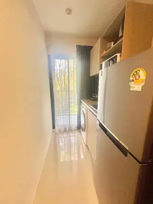 a kitchen with a refrigerator and a dishwasher at Dcondo Reef Serenity Condo 2 in Phuket Town