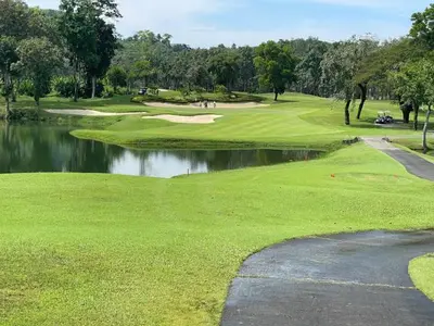 a view of a golf course with a pond at Студия мечтателя in Mai Khao Beach