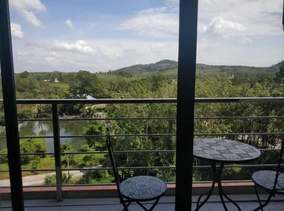 a view from a balcony with a table and chairs at Студия мечтателя in Mai Khao Beach