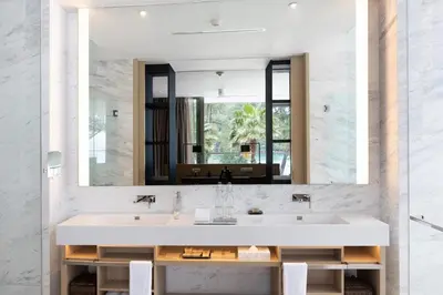 a bathroom with a sink and a large mirror at Luxury 3-Bedroom Sea View Apartment in MontAzure Kamala in Surin Beach