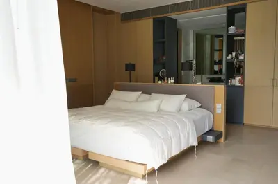 a bedroom with a large bed with a large mirror at Luxury 3-Bedroom Sea View Apartment in MontAzure Kamala in Surin Beach