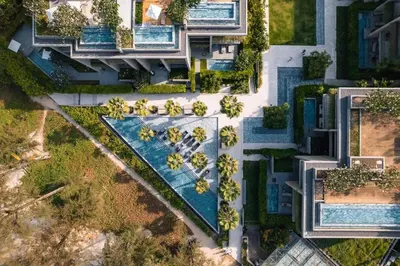 an overhead view of a building with a swimming pool at Luxury 3-Bedroom Sea View Apartment in MontAzure Kamala in Surin Beach