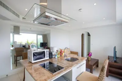a kitchen with a sink and a microwave at Scenic Kata SeaView Condo O17-1BR just 5 min Drive to Kata Beach in Karon Beach
