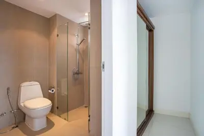 a bathroom with a toilet and a shower at Scenic Kata SeaView Condo O17-1BR just 5 min Drive to Kata Beach in Karon Beach