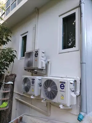 two air conditioners on the side of a building at Baan Sangchai Beach in Ko Bon