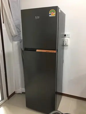 a black refrigerator in a room with at Baan Sangchai Beach in Ko Bon