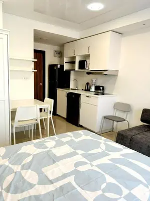 a room with a kitchen and a living room with a bed at New Apartment in 777 BEACH CONDO in Ban Mai Salae
