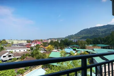 a view of a town from a balcony at Kamala Beach View 1 BdR Roof Pool 500 mbps WiFi in Kamala Beach