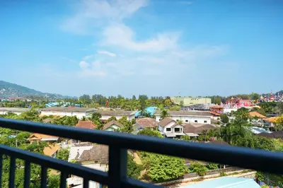 a view of a city from a balcony at Kamala Beach View 1 BdR Roof Pool 500 mbps WiFi in Kamala Beach