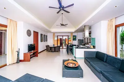 a living room with a couch and a table at Villa SALSA PRIVATE POOL in Ko Yao Noi