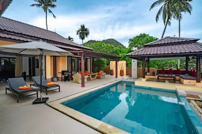 a swimming pool with a patio and a house at Villa SALSA PRIVATE POOL in Ko Yao Noi