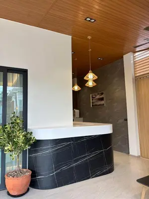 a kitchen with a black and white counter top at Mountain breeze villa phuket in Ban Bang Khu