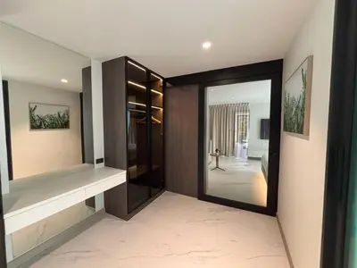 a room with a door and a mirror in a room at Mountain breeze villa phuket in Ban Bang Khu