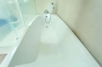 a bath tub with a faucet in a bathroom at A New Experience of Private Vacation and Work in Patong in Patong Beach