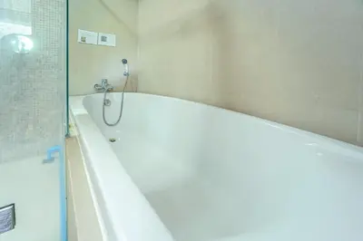 a bathroom with a bath tub and a shower at A New Experience of Private Vacation and Work in Patong in Patong Beach