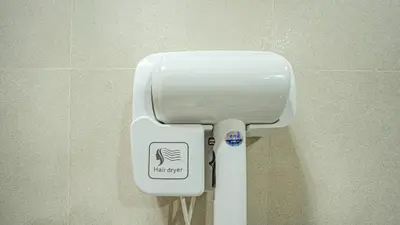a white toilet in a bathroom with a sign on it at A New Experience of Private Vacation and Work in Patong in Patong Beach