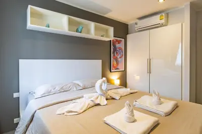 a bedroom with a bed with towels on it at Modern Condo - 1BR T1-201 in Ban Klang