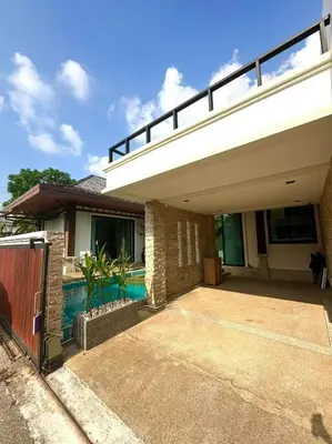 a house with a swimming pool in front of it at Pool Villa Private near Rawai Beach 2 bedrooms 3D9 in Rawai Beach