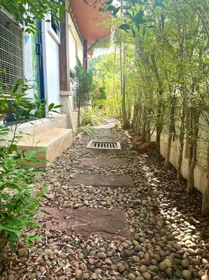 a stone path in front of a house with trees at Pool Villa Private near Rawai Beach 2 bedrooms 3D9 in Rawai Beach