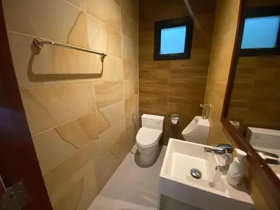 a bathroom with a toilet and a sink at Pool Villa Private near Rawai Beach 2 bedrooms 3D9 in Rawai Beach