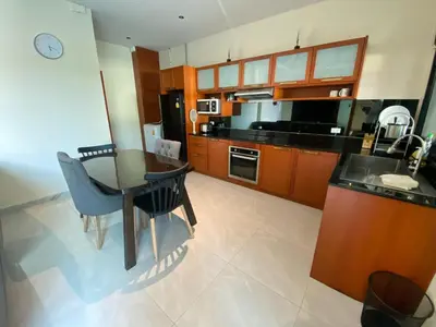 a kitchen with a table and a dining room at Pool Villa Private near Rawai Beach 2 bedrooms 3D9 in Rawai Beach