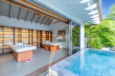 a villa with a swimming pool and a resort at Villa Amankara in Phuket Town
