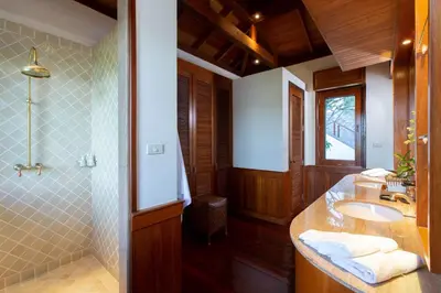 a bathroom with a sink and a shower at Villa Talaefun - Luxury Oceanfront Fully Serviced in Kamala Beach