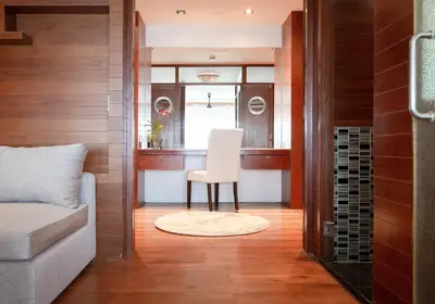a living room with a chair and a window at Villa Laemsingh 2 Oceanfront Fully Serviced in Surin Beach