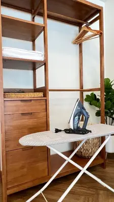 a shelf in a room with a surfboard on it at Charming home patong in Patong Beach