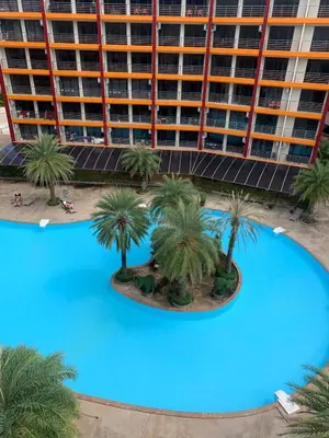 an overhead view of a large pool with palm trees at Cosy studio near the best beach on Phuket in Ban Mai Salae