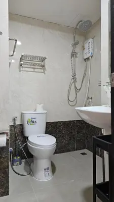 a bathroom with a toilet and a shower and a sink at Cosy studio near the best beach on Phuket in Ban Mai Salae