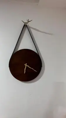 a hanging mirror with a drawing of a man on it at Kates cozy place in Mai Khao Beach