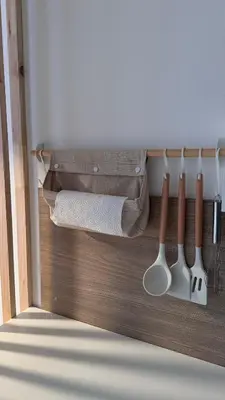 a row of kitchen utensils hanging from a wall at Kates cozy place in Mai Khao Beach