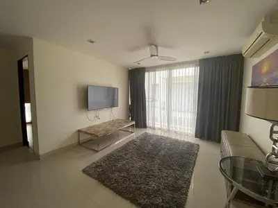 a living room with a television and a couch at 4bdr Villa with gym and pool in Laguna #168 in Laguna Phuket
