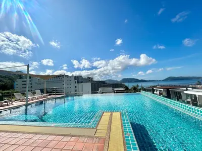 a large swimming pool on top of a building at 1 bedroom Suite Seaview In Kalim in Patong Beach