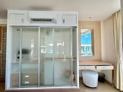 a glass cabinet in a room with a window at 1 bedroom Suite Seaview In Kalim in Patong Beach