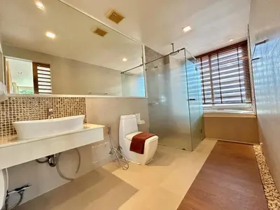 a bathroom with a toilet and a sink and a shower at 1 bedroom Suite Seaview In Kalim in Patong Beach