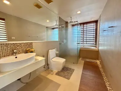 a bathroom with a sink and a toilet and a shower at 1 bedroom Suite Seaview In Kalim in Patong Beach