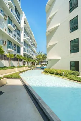 a swimming pool in front of a building at View 2Bdr Lux Life Rawai in Rawai Beach