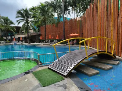 a slide in the middle of a swimming pool at 7 Floor - Pool view Studio room at TBHR near Kata beach in Kata Beach