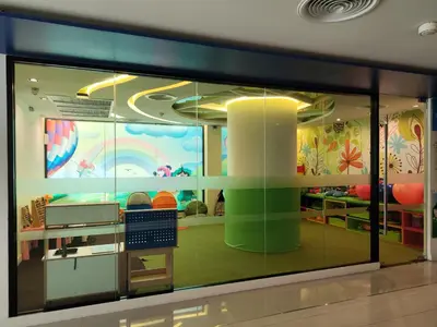 a store window with a rainbow mural on the wall at 7 Floor - Pool view Studio room at TBHR near Kata beach in Kata Beach