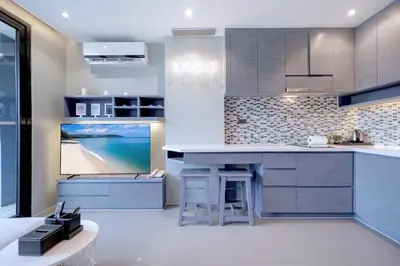 a kitchen with a view of the beach at Tropics Hill View Apartment CTG L706 at Kamala Residence, Top Amenities, Close to the Beach and Fantasea in Kamala Beach