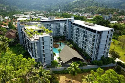 an aerial view of a building with a swimming pool at Tropics Kamala Hill View Suite CTG L708, Best Amenities near Kamala beach in Kamala Beach