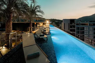 a large swimming pool on the roof of a building at Tropics Kamala Hill View Suite CTG L708, Best Amenities near Kamala beach in Kamala Beach