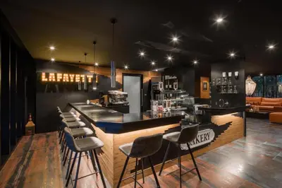 a bar with stools in a room with a counter at Green View Suite CTG P210 at Tropics Kamala Residence near Fantasea in Kamala Beach