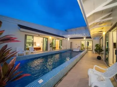 a large swimming pool in a house with a house at 4Luxury Pool Villa 4 Bedrooms Private Pool Kitchen in Ban Bang La