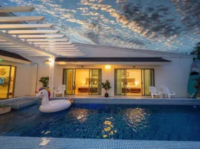 a swimming pool with a swan in the middle of a house at 4Luxury Pool Villa 4 Bedrooms Private Pool Kitchen in Ban Bang La